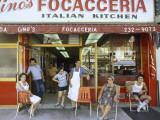A Family Sits Outside Gino Pollari's Italian Restaurant in Brooklyn