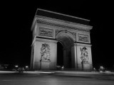 Traffic Passes the Arc De Triomphe at Night