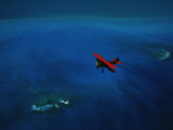 An Airplane Flying over Water