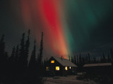 The Aurora Borealis Colors the Sky over a Residence