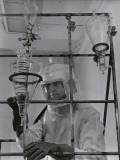 Chemist in Protective Gear Working in a Lab