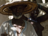 Portrait of a Malian Man  His Face Shaded by a Straw Hat
