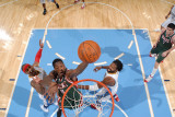 Milwaukee Bucks v Denver Nuggets: Larry Sanders  Carmelo Anthony and Nene