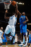 Dallas Mavericks v New Orleans Hornets: Brendan Haywood and Emeka Okafor