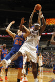 New York Knicks v Charlotte Bobcats: Kwame Brown and Timofey Mozgov