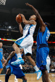 Dallas Mavericks v New Orleans Hornets: Jerryd Bayless and Brendan Haywood