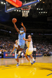Denver Nuggets v Golden State Warriors: Ty Lawson and Dan Gadzuric
