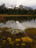 Dusted with Snow  the Ramparts Tower Above Spruce-Fringed Moat Lake
