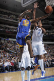 Golden State Warriors v Dallas Mavericks: Reggie Williams and Alexis Ajinca