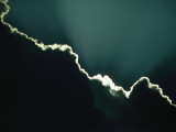 Rays of Sunlight Peek Out from Behind a Cloud