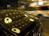 A Display of Lights Reflected on a Car