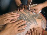 Monks Tatooing at the Wat Bang Phra Buddhist Temple