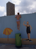 A Boy Peeking over Wall of a Hotel Swimming Pool in Monaco