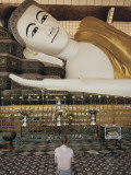 A Man Prays before the Reclining Shwethalyaung Buddha Statue