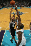 San Antonio Spurs v New Orleans Hornets: Tony Parker and Emeka Okafor