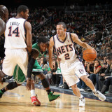 Boston Celtics v New Jersey Nets: Jordan Farmar  Derrick Favors and Nate Robinson