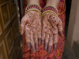 A Henna Tattoo Is Painted on Hands in Celebration of Diwali