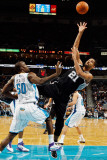San Antonio Spurs v New Orleans Hornets: Tim Duncan and Emeka Okafor