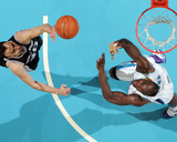 San Antonio Spurs v New Orleans Hornets: Manu Ginobili and Emeka Okafor