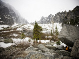 Climbers Eat Dinner under an Overhanging Rock in the Wa Backcountry