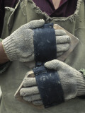 A Tibetan Pilgrim with Hand Guards for Prostrating
