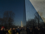 Visitors and Washington Monument Reflected in the Vietnam Memorial