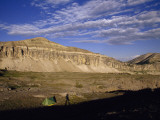 Sunrise on the Teton Crest Trail Illuminates Mount Meek and a Lone Backpacker and Tent