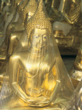 Buddha Statues Wrapped in Plastic
