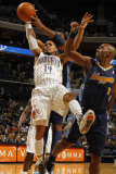 Denver Nuggets v Charlotte Bobcats: DJ Augustin and Nene