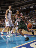 Milwaukee Bucks v Dallas Mavericks: Brandon Jennings and Dirk Nowitzki