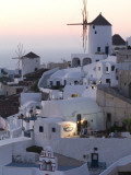 Stuccoed Houses and Windmills on a Hillside at Twilight
