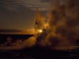 Yellowstone's Clepsydra Geyser Erupts in the Twilight Scene