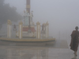 A Buddhist Monk at the Golden Rock in the Fog