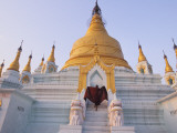 A Monk Runs Up the Steps of a Stupa
