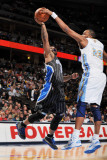 Orlando Magic v Denver Nuggets: Jameer Nelson and Shelden Williams