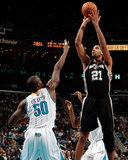 San Antonio Spurs v New Orleans Hornets: Tim Duncan and Emeka Okafor