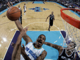 San Antonio Spurs v New Orleans Hornets: Trevor Ariza and Tim Duncan