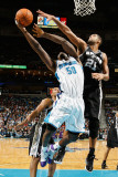 San Antonio Spurs v New Orleans Hornets: Emeka Okafor and Tim Duncan