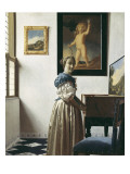 A Young Woman Standing at a Virginal