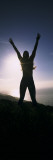 Young Woman Exercising on a Hill