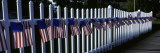 American Flags Hanging on a Picket Fence