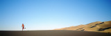 Woman Running in the Desert  Great Sand Dunes National Monument  Colorado  USA