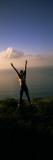 Young Woman Exercising on a Hill