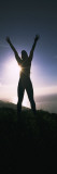 Young Woman Exercising on a Hill