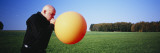 Mature Man Blowing a Balloon  Germany