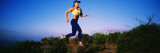 Side Profile of a Female Athlete Jogging on a Hilltop  Santa Monica Mountains  California  USA