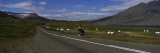 Boy Riding a Bicycle on a Road  Iceland