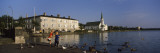 Two Boys Feeding Ducks at the Lakeside  Tjornin  Reykjavik  Iceland