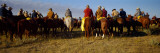 Cowboys Riding Horses in a Field
