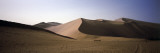 Tourists Riding Camels in a Desert  Dunhuang  Jiuquan  Gansu Province  China